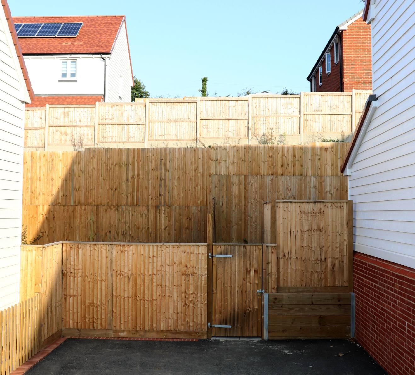 Back garden fencing with long drops that could be dangerous for children